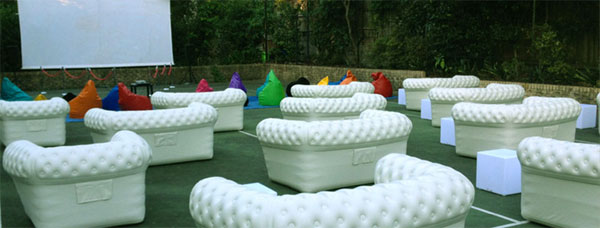 Chesterfield Inflatable Sofas on Tennis Court for Movie Night